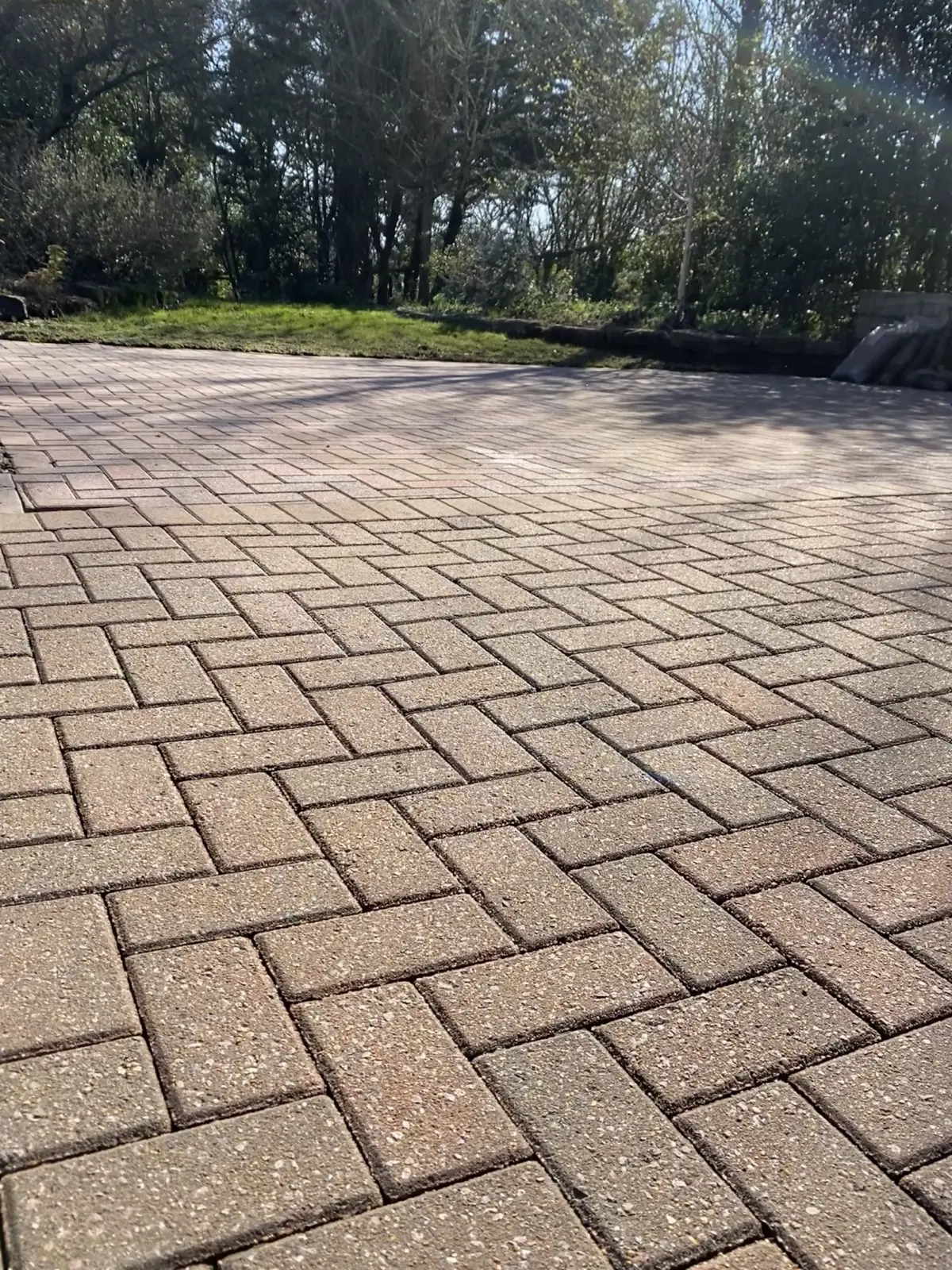 Block paved driveway after jet washing, clean across the full width